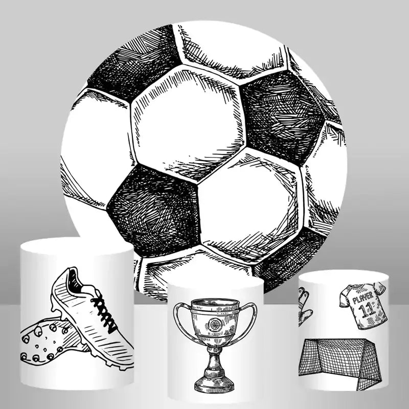 Soccer-themed party backdrop set featuring a large round backdrop with a soccer ball design and three cylinder covers with soccer illustrations of shoes, a trophy, and a goalpost.