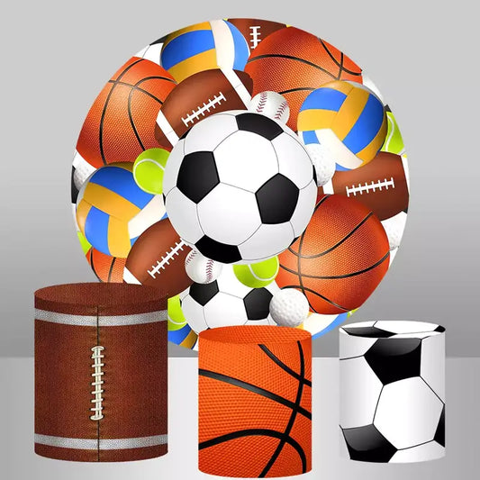 A sports-themed decor set featuring a round backdrop with various sports balls including soccer, basketball, football, volleyball, and tennis, paired with cylinder covers designed with basketball, football, and soccer ball patterns