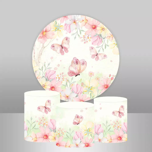 Floral and butterfly-themed round backdrop with matching cylinder covers featuring pink and peach flowers and butterflies.