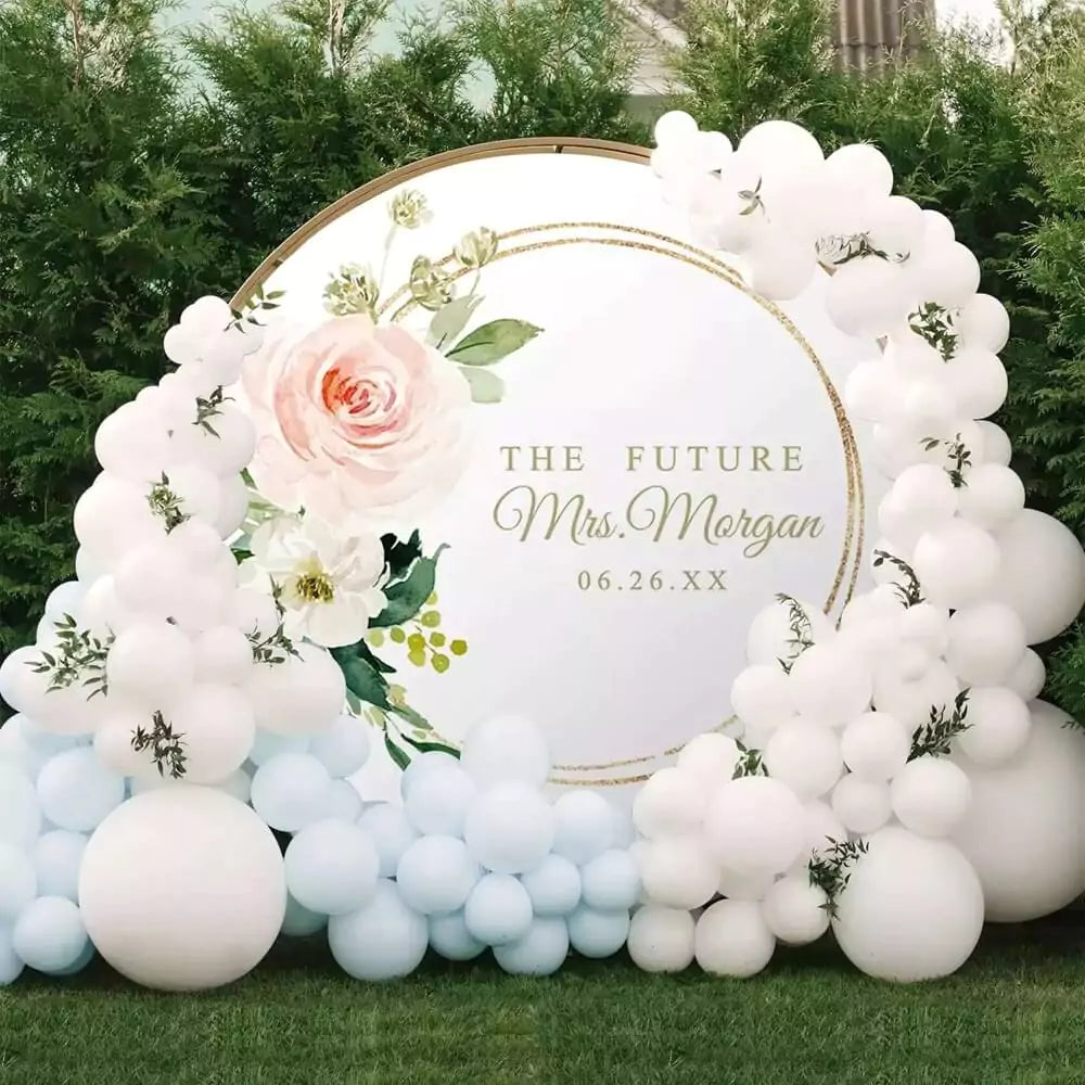 Elegant future Mrs. backdrop featuring soft pink flowers and gold circle