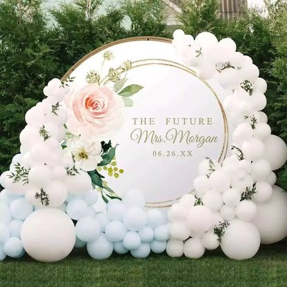 Elegant future Mrs. backdrop featuring soft pink flowers and gold circle
