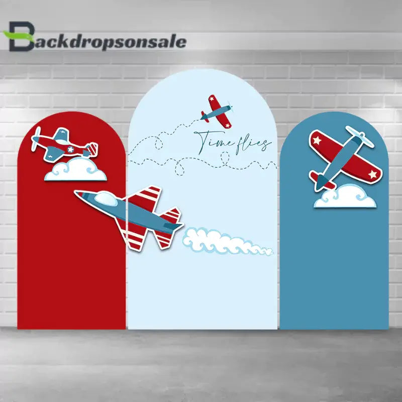 Airplane-themed arch backdrop set with three panels featuring red and blue airplanes, clouds, and the text "Time flies," perfect for birthdays and aviation-themed events.