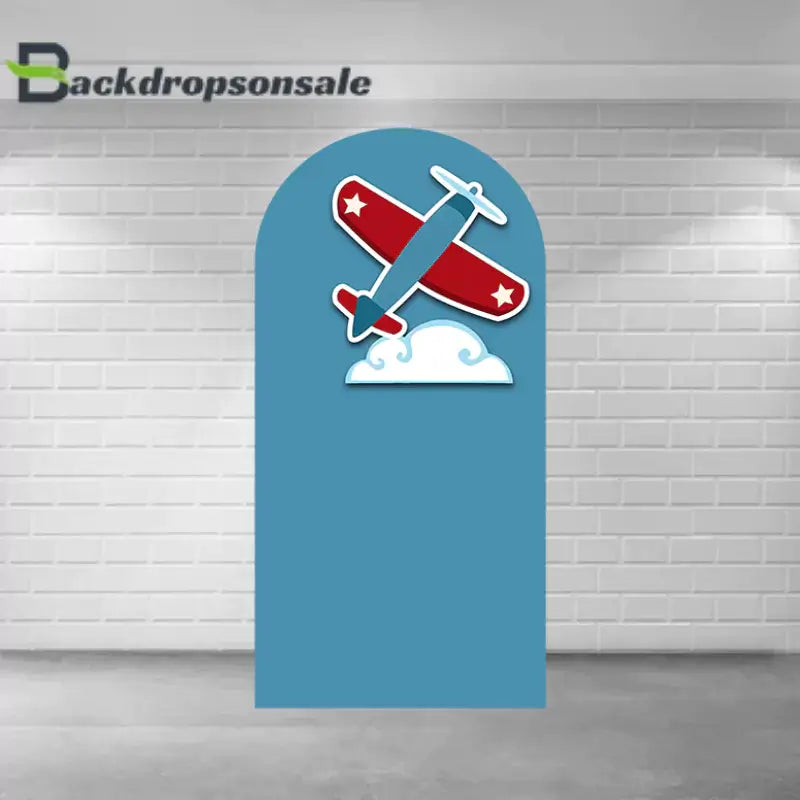 Right arch panel of the airplane backdrop set featuring a blue background, a red airplane, and a cloud.