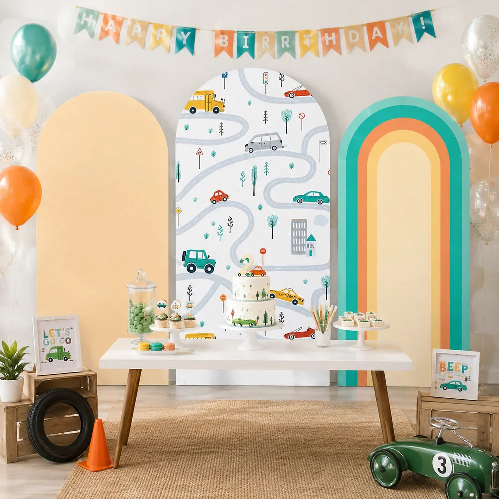 Kids transportation party set with three arch backdrop covers featuring colorful cars, winding roads, traffic signs, a warm peach panel and a retro rainbow arch design.