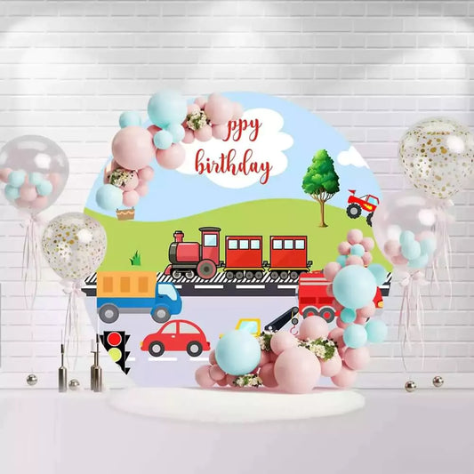 Round birthday backdrop with transportation theme featuring a train, cars, trucks, and a hot air balloon