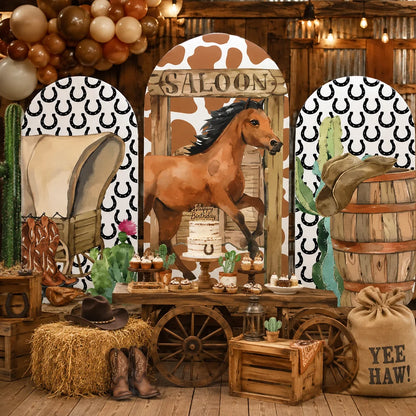 Western cowboy party set with three arch backdrop covers featuring a horse at a rustic saloon, covered wagon, cowboy boots, saddle, wooden barrel, cactus and horseshoe patterns.
