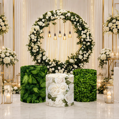 Elegant white rose and greenery party set with one round floral backdrop and three matching cylinder covers featuring leafy green and white rose designs.